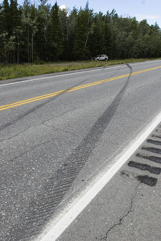 An investigation will reveal that the vehicle experienced a tread separation and the seatbelt unlatched during the wreck. 